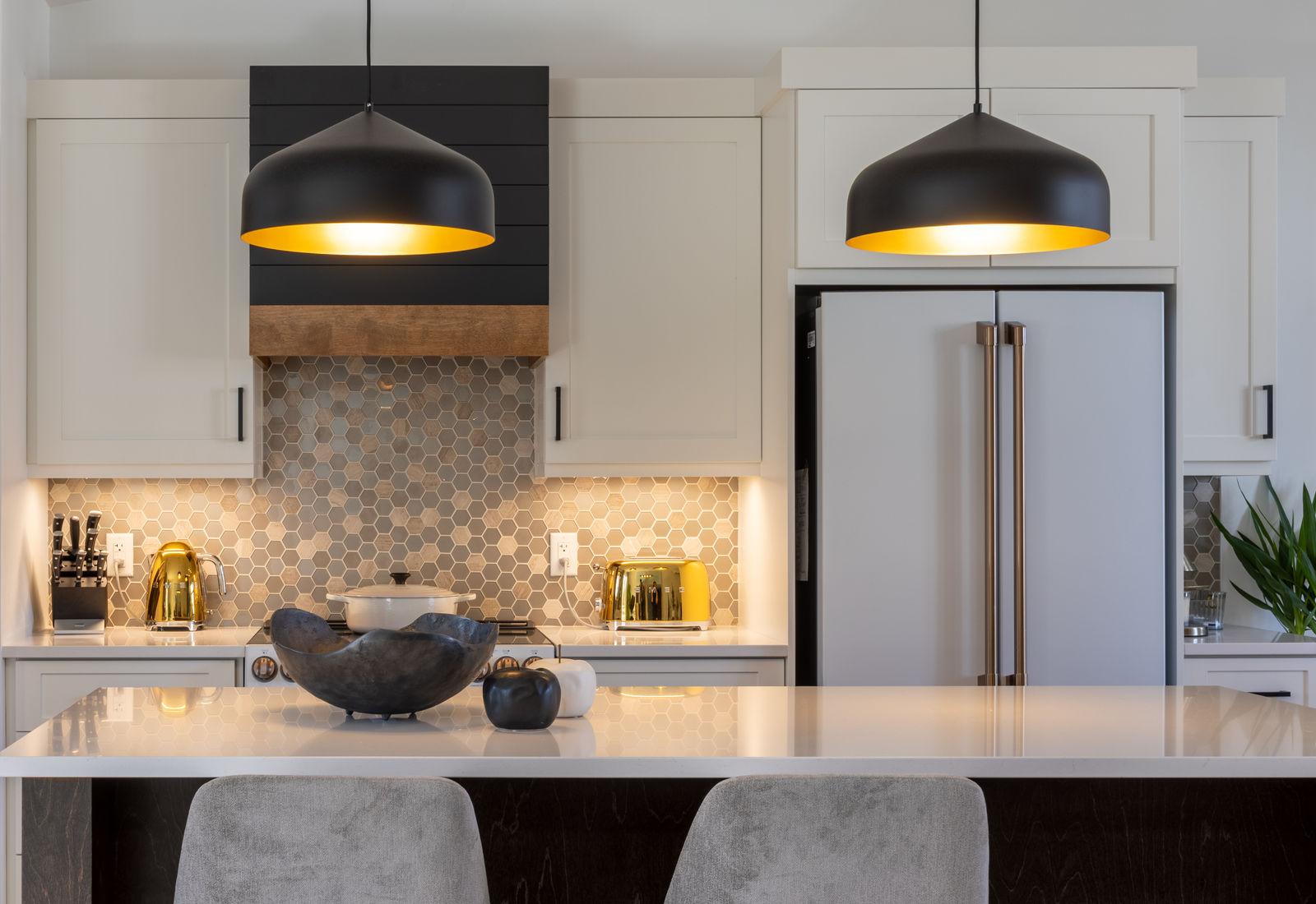 Renovated kitchen with pendant lighting designed by MAD Design Interiors