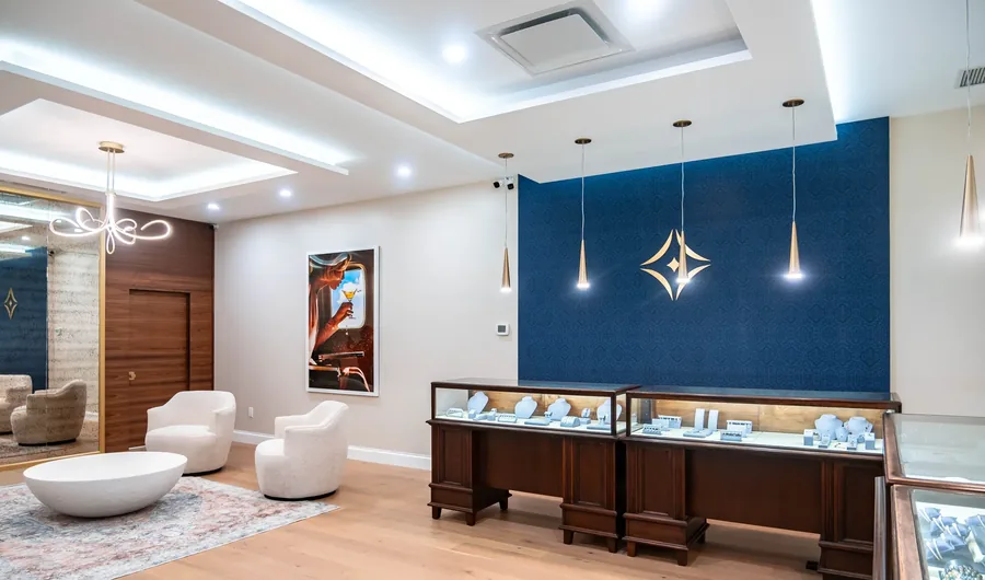 La Mine d'Or — A jewellery showroom rebuilt around how customers move between the cases — navy, brass and warm walnut. Designed by MAD Design Interiors in Halifax.